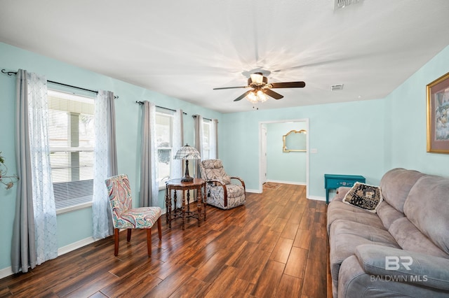 2553 Santa Rosa Dr, Lillian, AL 36549 - living area featuring baseboards, dark wood-type flooring, and plenty of natural light