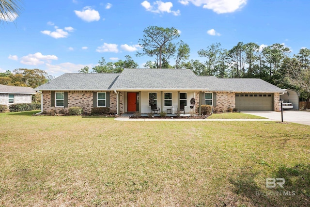 2553 Santa Rosa Dr, Lillian, AL 36549 - ranch-style house featuring a garage, driveway, a front yard, a porch, and brick siding