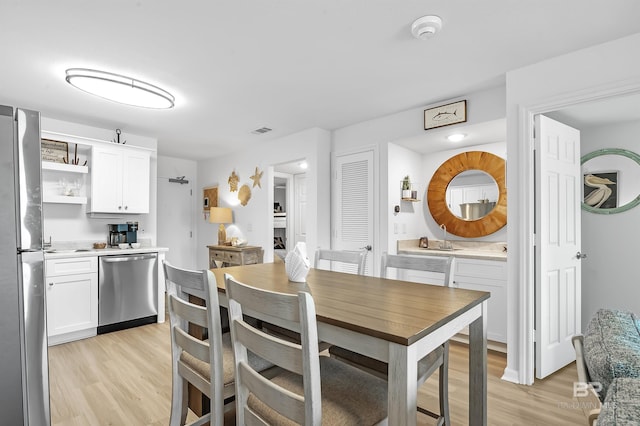 dining space featuring light hardwood / wood-style floors