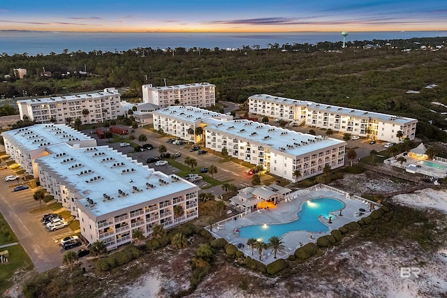 aerial view at dusk with a water view