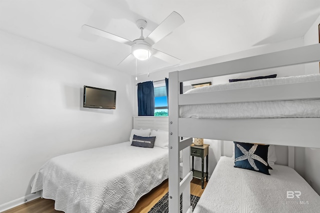 bedroom featuring ceiling fan and hardwood / wood-style flooring