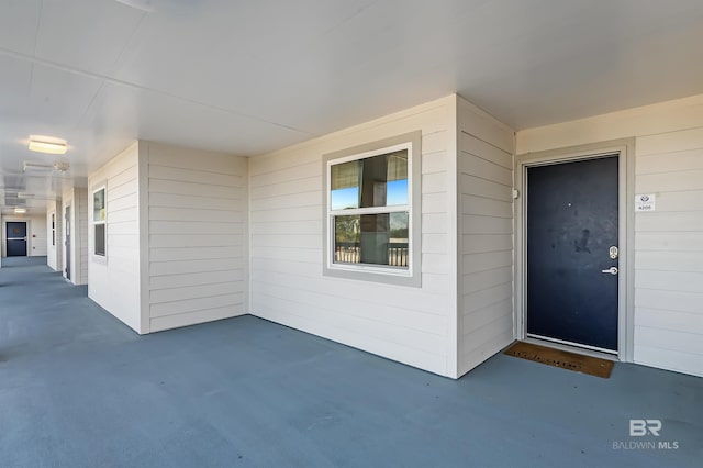 entrance to property featuring a patio area