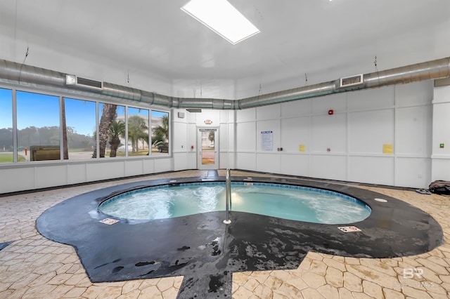 view of pool featuring an indoor hot tub