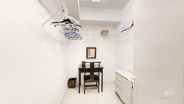 walk in closet featuring light tile patterned flooring