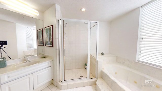 bathroom with vanity, tile patterned flooring, and plus walk in shower