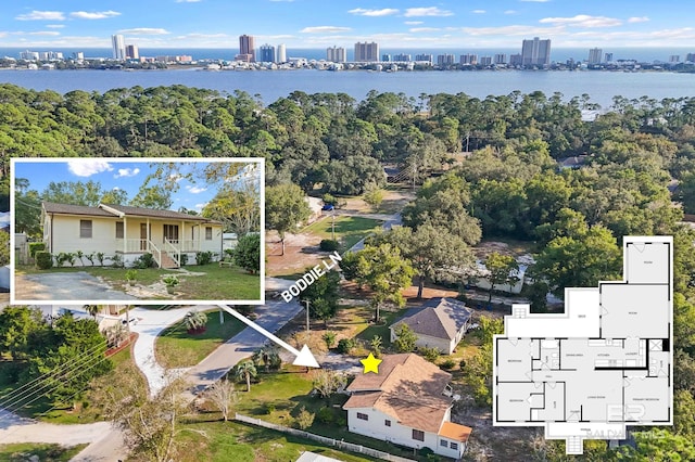 birds eye view of property featuring a water view