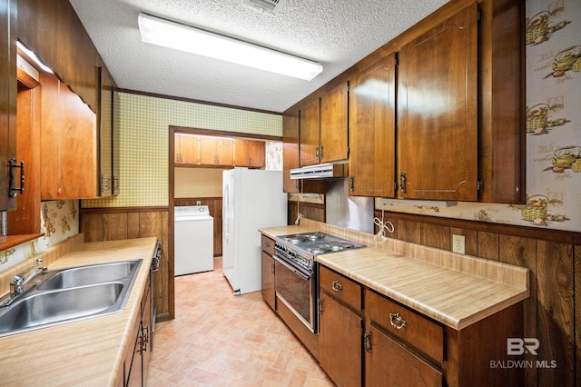 kitchen with washer / dryer, sink, electric stove, a textured ceiling, and white refrigerator