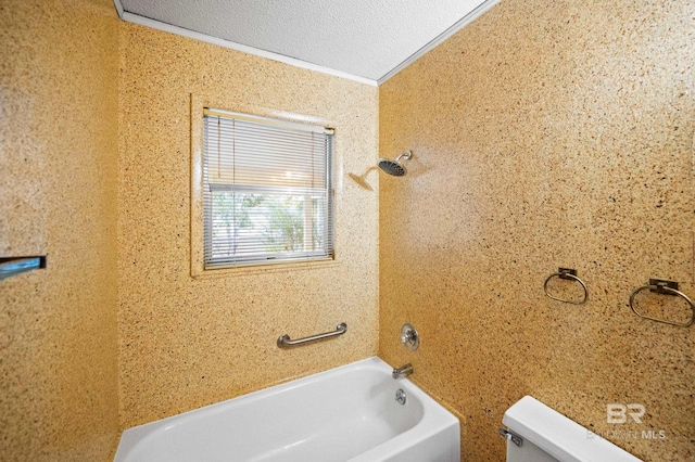 bathroom with toilet, crown molding, a textured ceiling, and washtub / shower combination