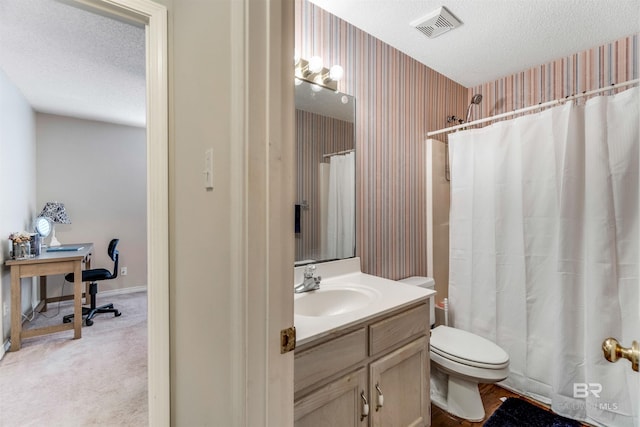 full bathroom with a textured ceiling, toilet, vanity, visible vents, and wallpapered walls