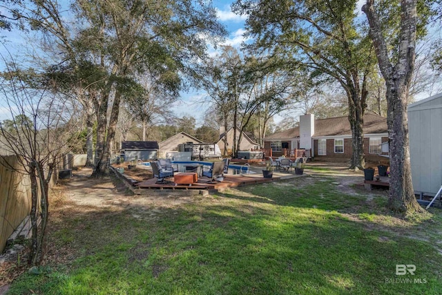 view of yard with a deck