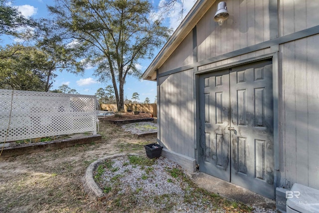 exterior space with fence and an outdoor structure