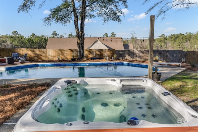 view of pool with fence and a patio