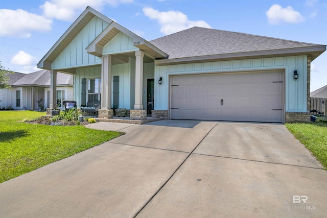 view of front of home featuring board and batten siding, a shingled roof, a front lawn, a garage, and driveway