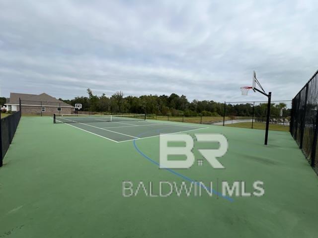 view of sport court with fence