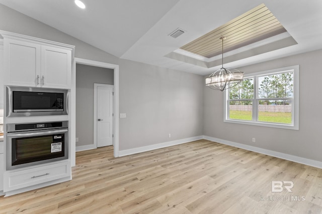 LOT9 Tall Timber Ln, Elberta, AL 36530 - kitchen with appliances with stainless steel finishes, a tray ceiling, a chandelier, and light wood-style floors
