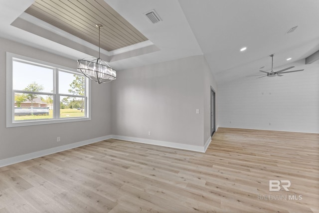 LOT9 Tall Timber Ln, Elberta, AL 36530 - unfurnished room with a tray ceiling, light wood-style floors, a chandelier, recessed lighting, and a ceiling fan