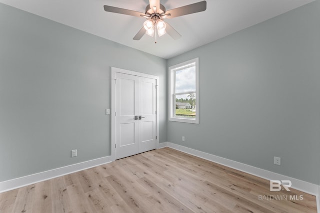 LOT9 Tall Timber Ln, Elberta, AL 36530 - unfurnished bedroom with light wood-style flooring, a closet, and a ceiling fan