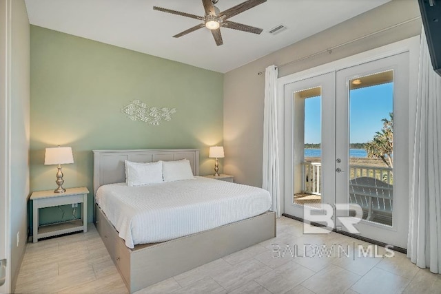 bedroom featuring french doors, access to outside, ceiling fan, and a water view