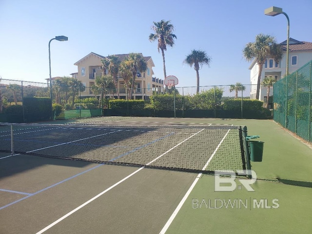 view of sport court with basketball hoop