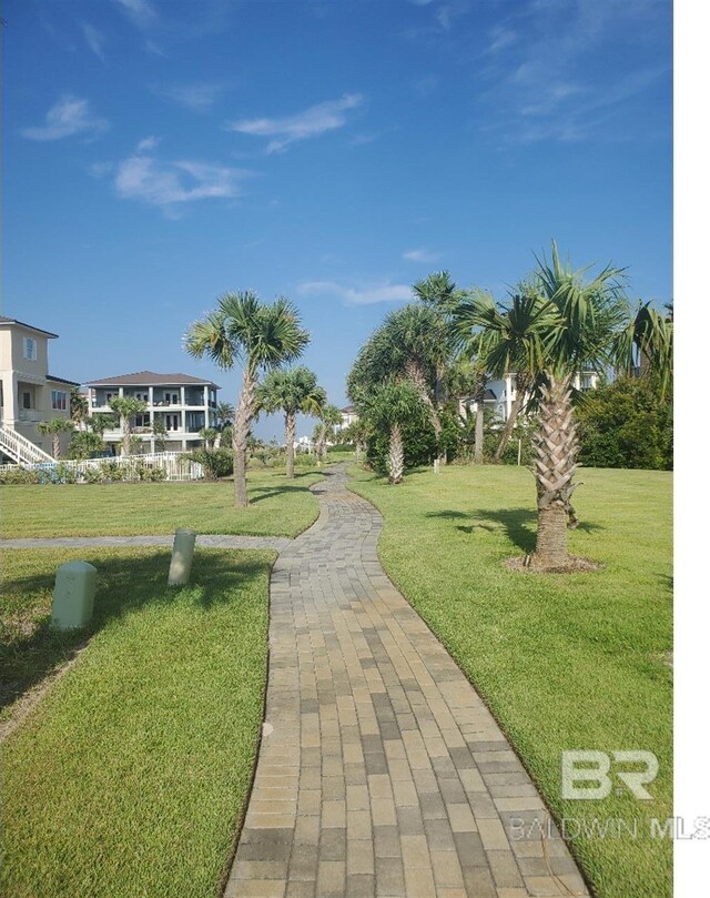 surrounding community featuring a lawn