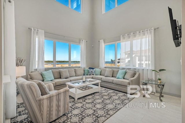 living room with a towering ceiling
