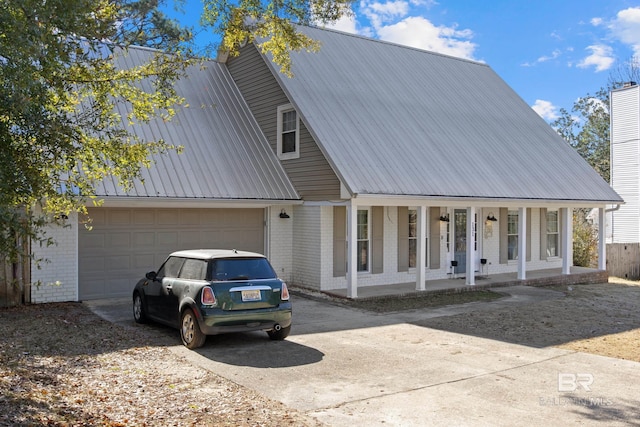 view of front facade with a garage and covered porch