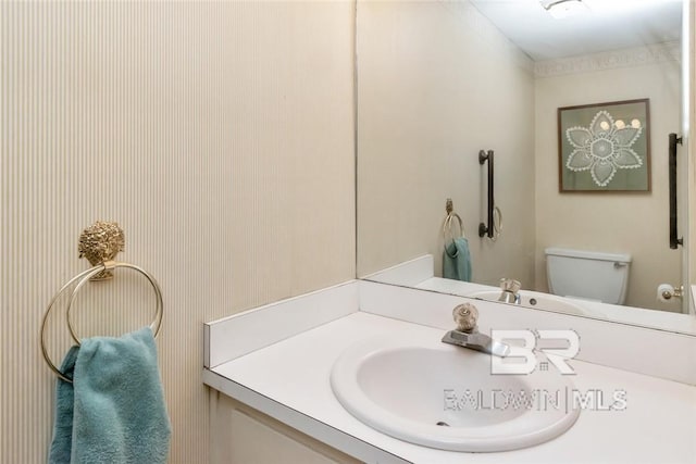 bathroom with vanity and toilet