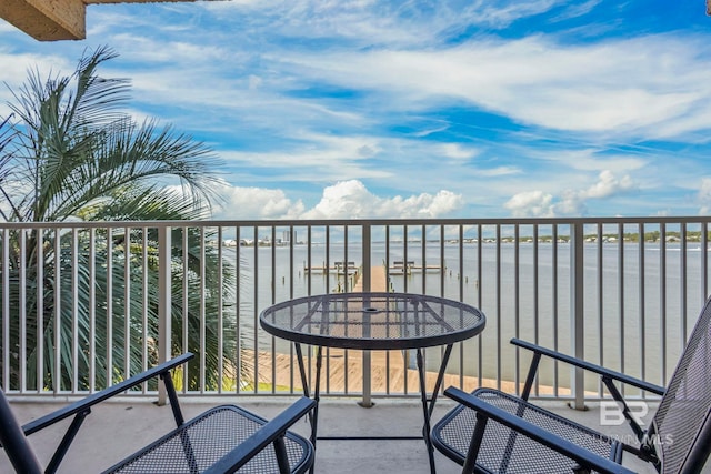 balcony featuring a water view