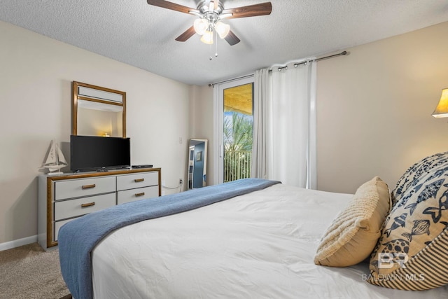 carpeted bedroom with ceiling fan, a textured ceiling, and access to exterior