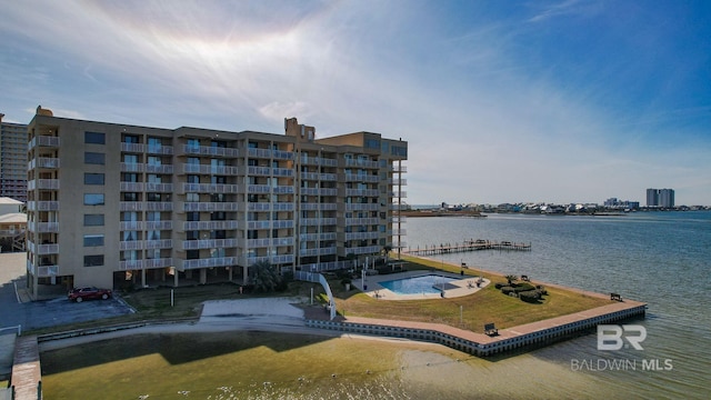 view of building exterior with a water view