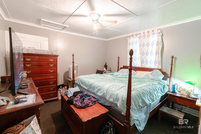 bedroom featuring dark carpet, ceiling fan, and ornamental molding