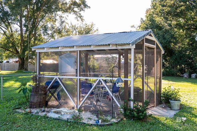 view of outbuilding featuring a yard