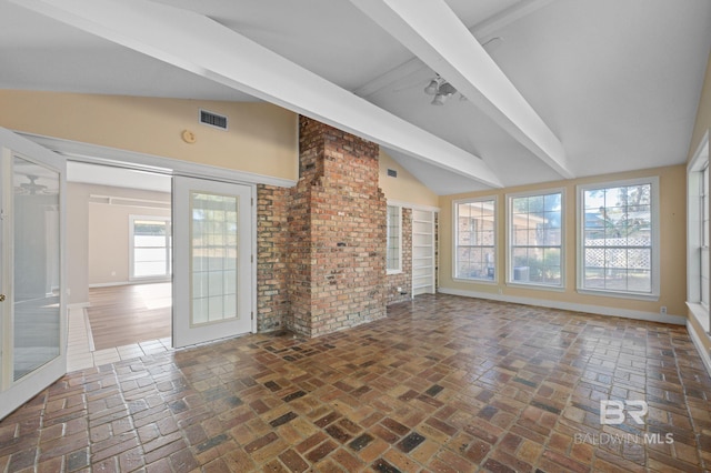 unfurnished living room with lofted ceiling with beams, ceiling fan, and french doors