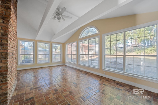 unfurnished sunroom featuring ceiling fan and lofted ceiling with beams