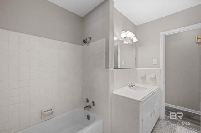 bathroom featuring vanity and washtub / shower combination