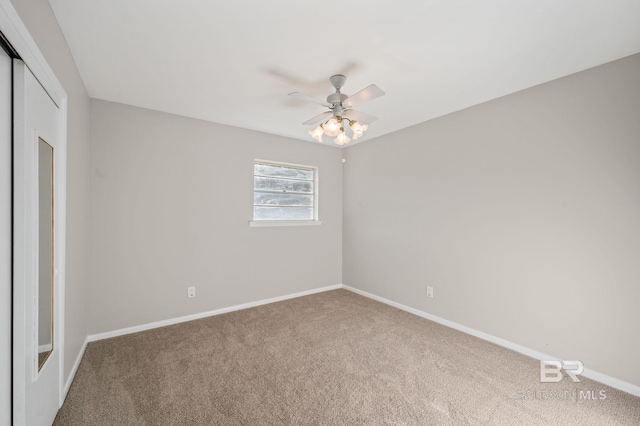 unfurnished bedroom featuring carpet flooring, ceiling fan, and a closet