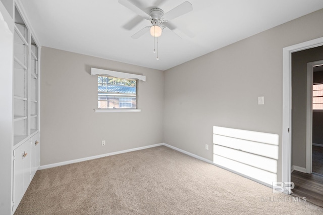 unfurnished bedroom featuring carpet and ceiling fan