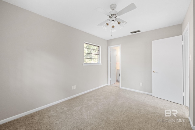 unfurnished bedroom with ceiling fan and light colored carpet