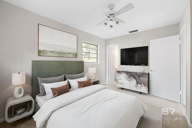 carpeted bedroom with ceiling fan