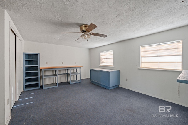 interior space featuring ceiling fan