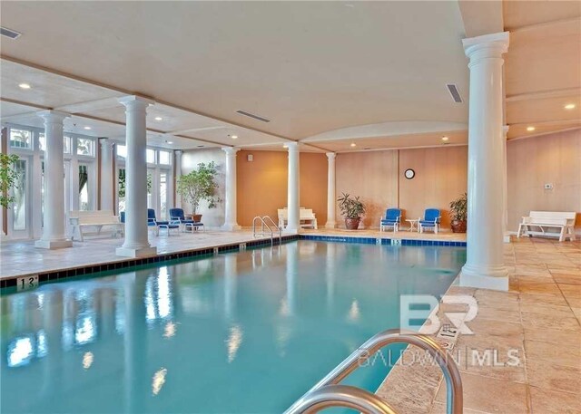 view of pool featuring ornate columns