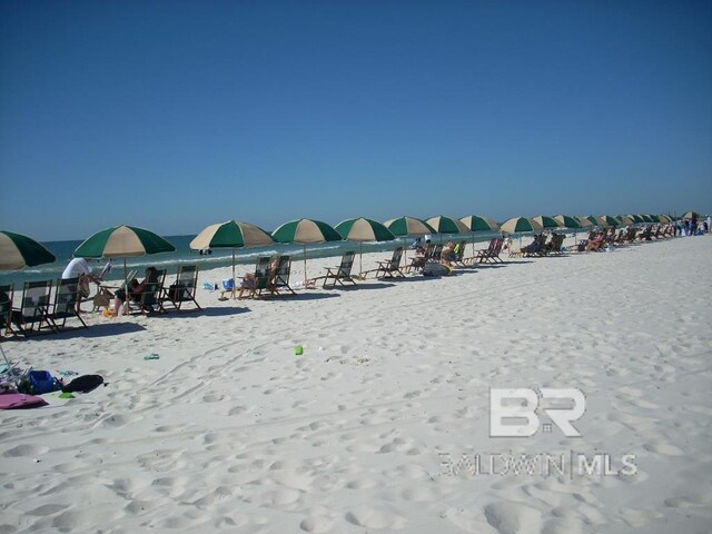 property view of water featuring a beach view