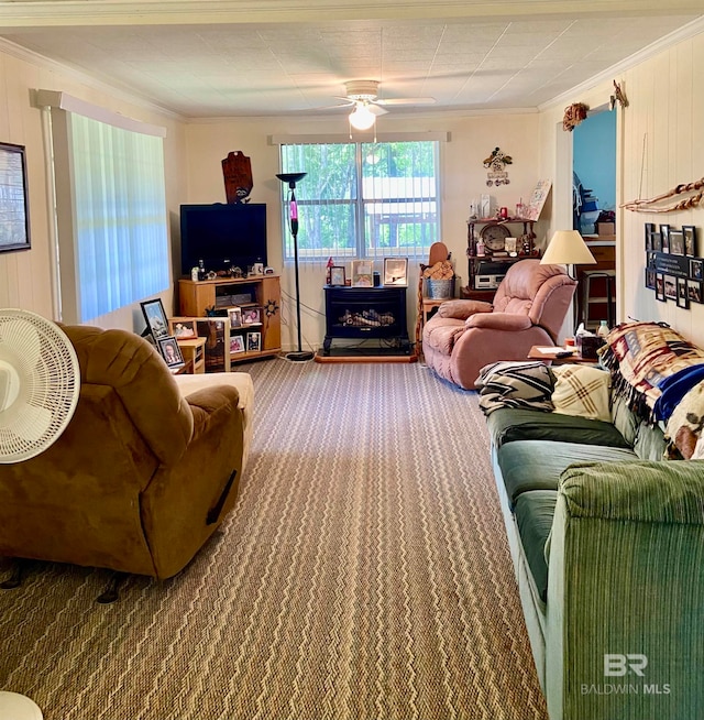 living room featuring ceiling fan and crown molding