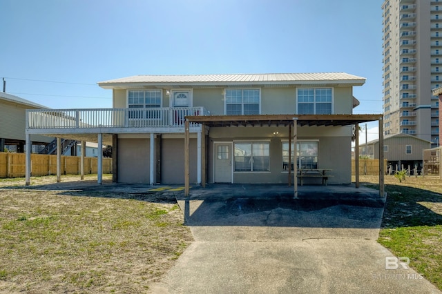 view of property with a garage and a deck