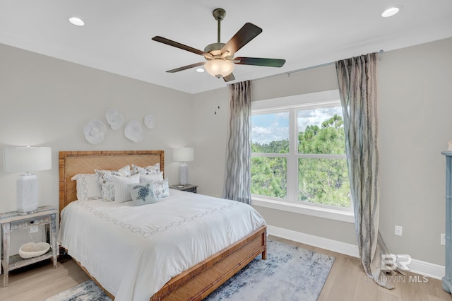 bedroom with light wood-style flooring, recessed lighting, baseboards, and ceiling fan