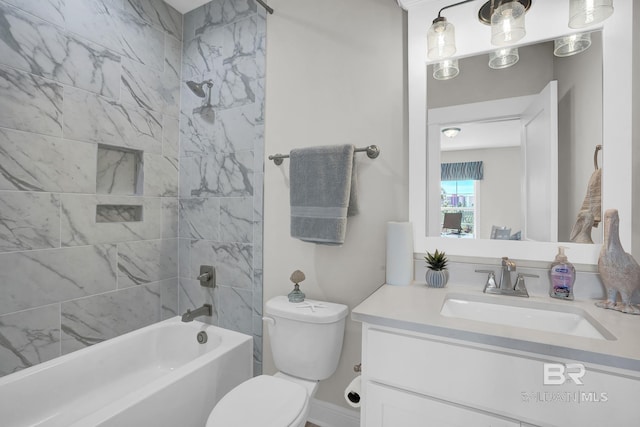 bathroom featuring vanity, toilet, and shower / washtub combination