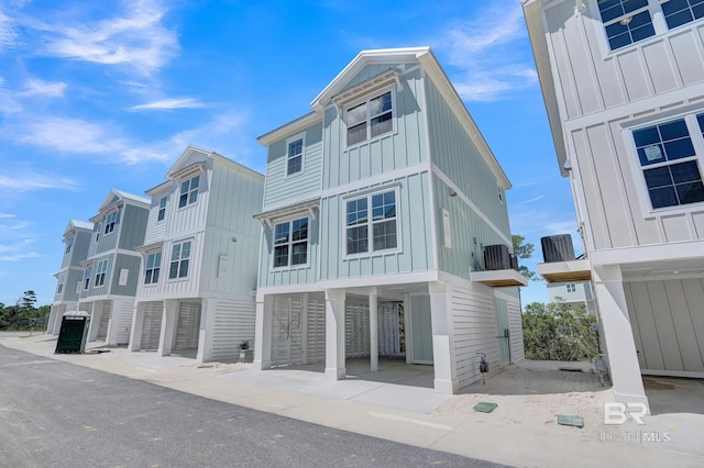 view of front of property with a carport and board and batten siding