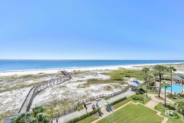 drone / aerial view with a water view and a view of the beach