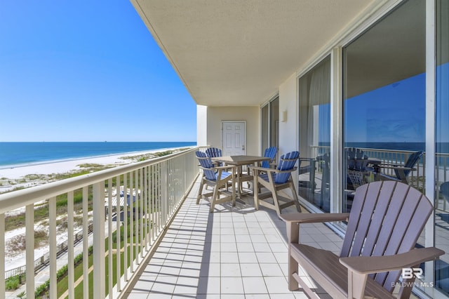 balcony with a view of the beach and a water view