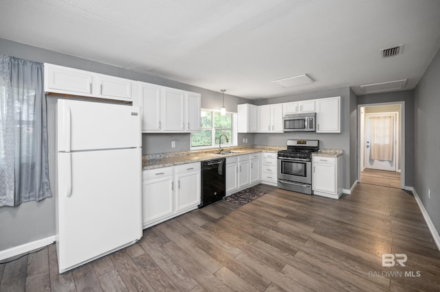 kitchen featuring stainless steel appliances, dark hardwood / wood-style flooring, hanging light fixtures, sink, and white cabinets